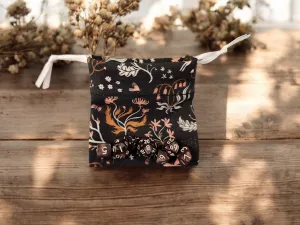 Mini drawstring bag with a set of mini dice, brown dice