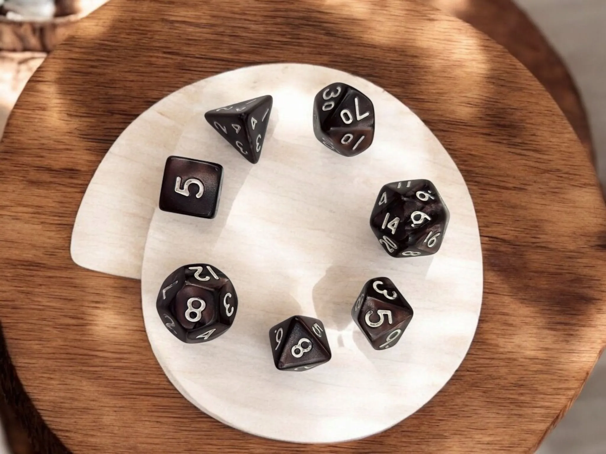 Mini drawstring bag with a set of mini dice, brown dice